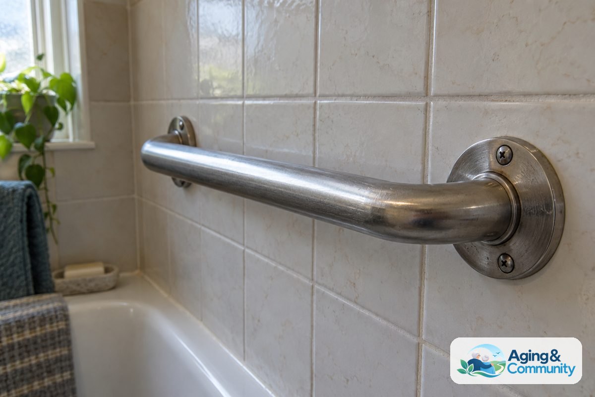 How to Modify Old House Spaces for Safer Living 4 Close-up documentary photograph of a sturdy grab bar securely anchored to bathroom wall studs with proper mounting hardware and a smooth finish.